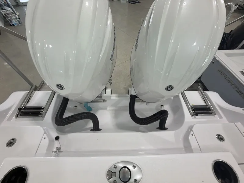 Slide: The Image of Two outboard engines are mounted on the rear of a Sportsman Heritage 261 Center Console boat. - 7