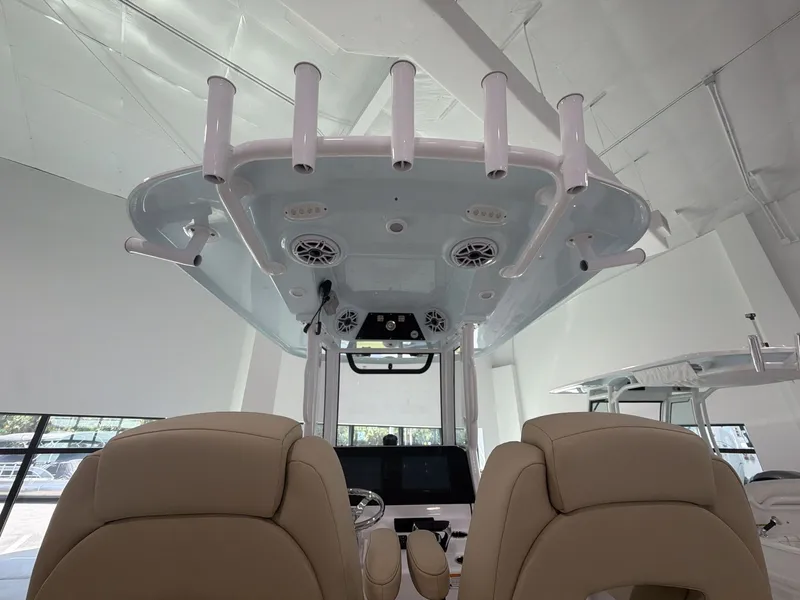 Slide: The Image of The image shows the cockpit of a Sportsman Heritage 261 Center Console boat with modern seating and electronics. - 3