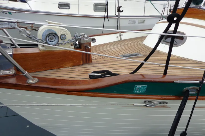 Slide: The Image of 1988 Ta Shing Tashiba Cutter sailboat deck with wooden finish and anchor chain. - 51
