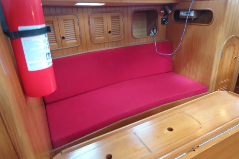 Slide: The Image of Interior of 1988 Ta Shing Tashiba Cutter with red seating and wooden cabinetry. - 36