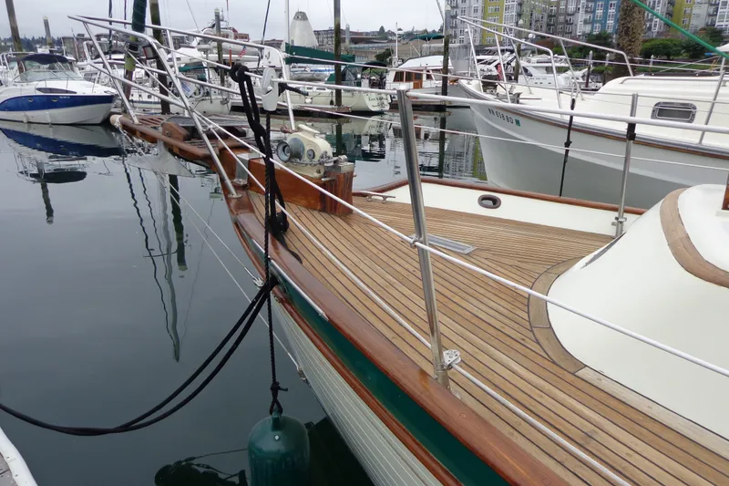 Slide: The Image of 1988 Ta Shing Tashiba Cutter with teak deck, docked in a marina. - 49