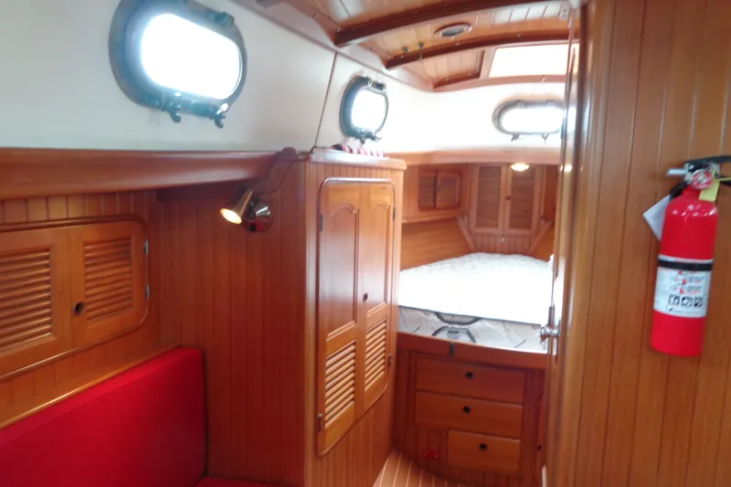 Slide: The Image of 1988 Ta Shing Tashiba Cutter interior with wooden paneling and cozy cabin space. - 28