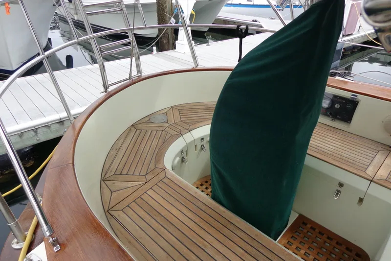 Slide: The Image of 1988 Ta Shing Tashiba Cutter sailboat cockpit with wooden deck and covered helm. - 15
