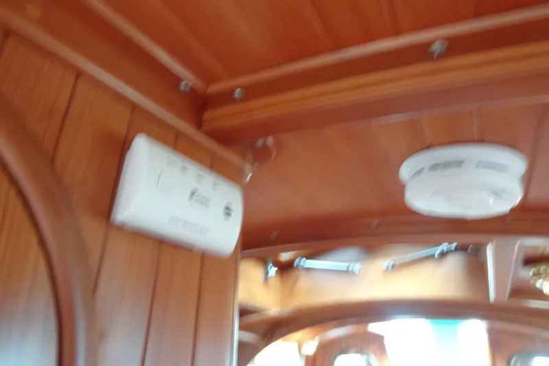 Slide: The Image of Interior of 1988 Ta Shing Tashiba Cutter with wooden paneling and smoke detector. - 42