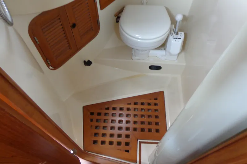 Slide: The Image of 1988 Ta Shing Tashiba Cutter bathroom with wooden accents and marine toilet. - 32
