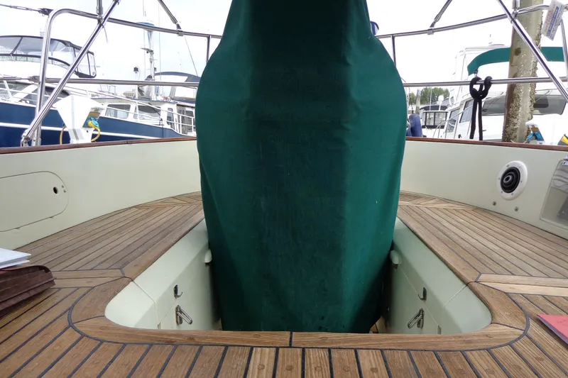 Slide: The Image of 1988 Ta Shing Tashiba Cutter sailboat cockpit with wooden deck and green cover. - 41