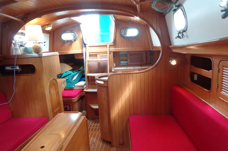 Slide: The Image of Interior of 1988 Ta Shing Tashiba Cutter with wooden paneling and red seating. - 47