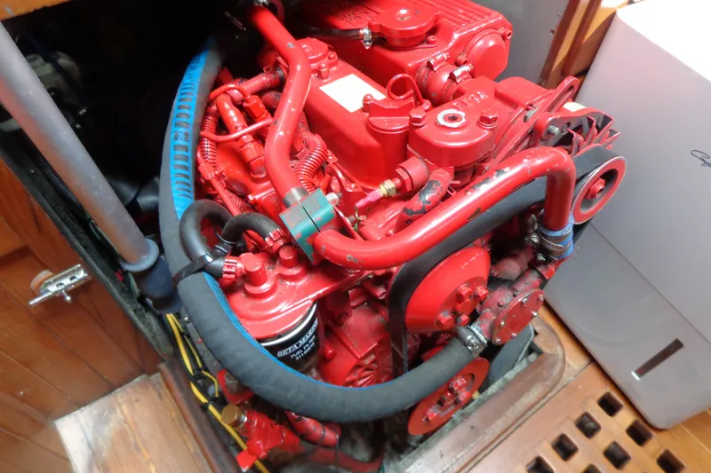 Slide: The Image of Red engine of a 1988 Ta Shing Tashiba Cutter sailboat, detailed view. - 39
