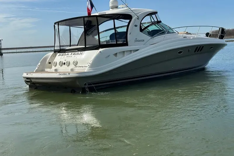 Slide: The Image of 2006 Sea Ray 44 Sundancer yacht on calm water, rear view with canopy. - 14