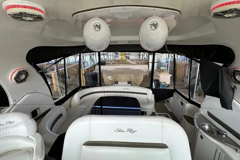Slide: The Image of Interior of 2006 Sea Ray 44 Sundancer yacht with white seating and modern design. - 29