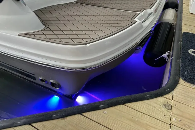 Slide: The Image of 2006 Sea Ray 44 Sundancer boat with blue underwater lights at dock. - 46