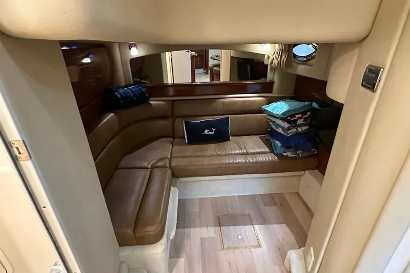Slide: The Image of Interior of 2006 Sea Ray 44 Sundancer yacht with leather seating and nautical decor. - 25