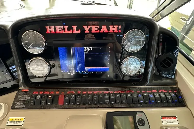Slide: The Image of Control panel of a 2006 Sea Ray 44 Sundancer boat with gauges and switches. - 33