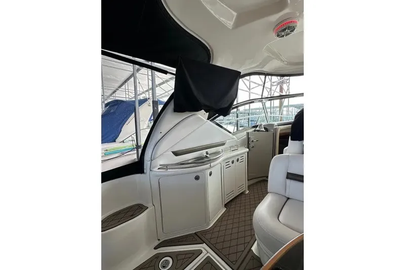 Slide: The Image of Interior view of 2006 Sea Ray 44 Sundancer yacht with seating and cabinetry. - 30