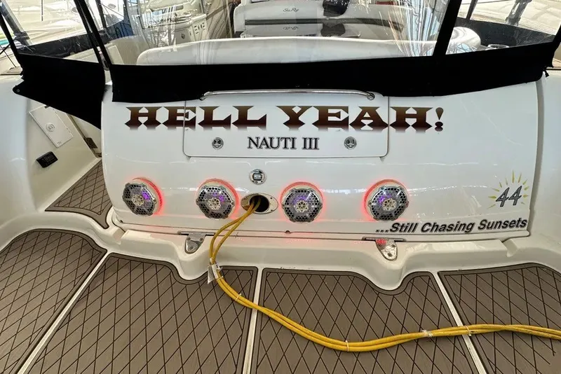 Slide: The Image of 2006 Sea Ray 44 Sundancer boat with "HELL YEAH!" and "Still Chasing Sunsets" text. - 40