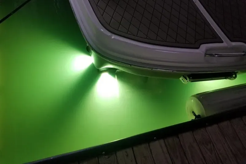 Slide: The Image of 2006 Sea Ray 44 Sundancer with underwater green lights at night. - 47