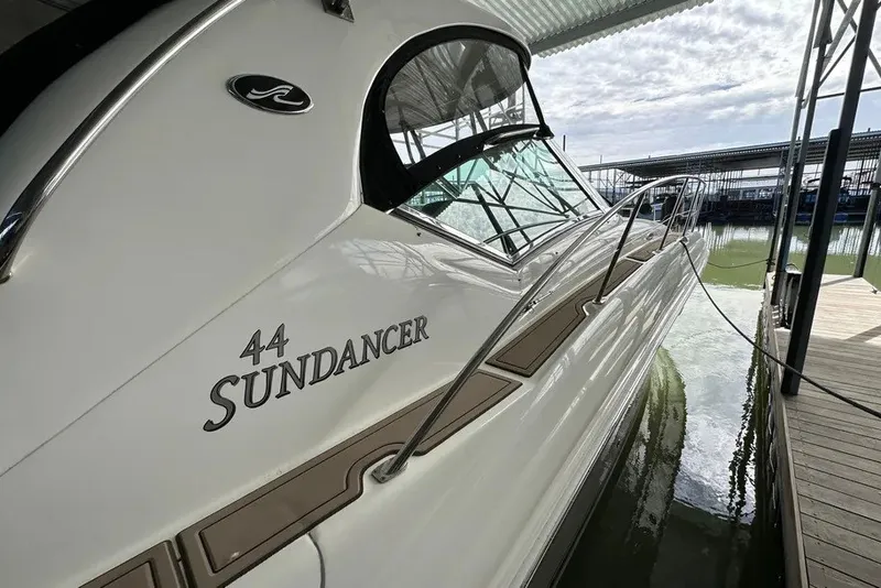 Slide: The Image of 2006 Sea Ray 44 Sundancer yacht docked at marina under a canopy. - 41