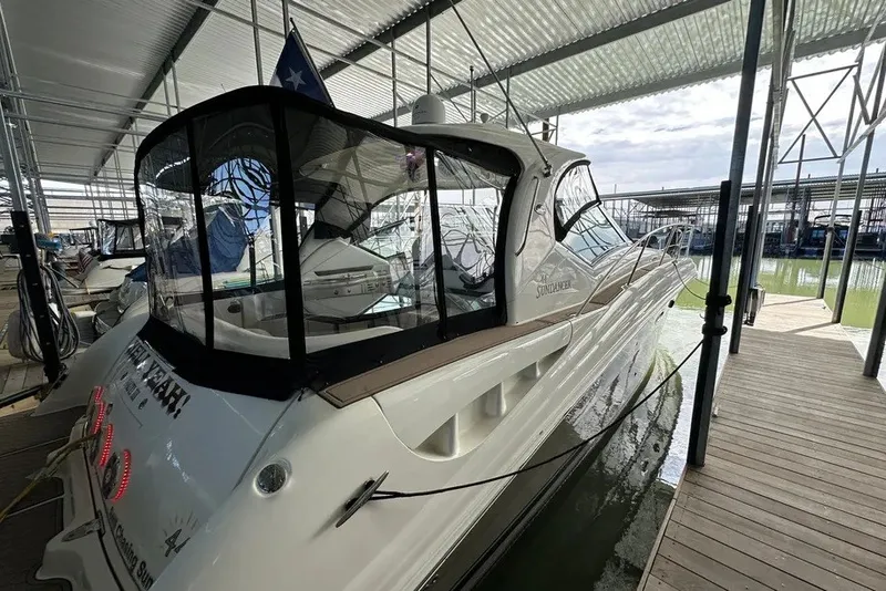 Slide: The Image of 2006 Sea Ray 44 Sundancer yacht docked in a covered marina. - 37