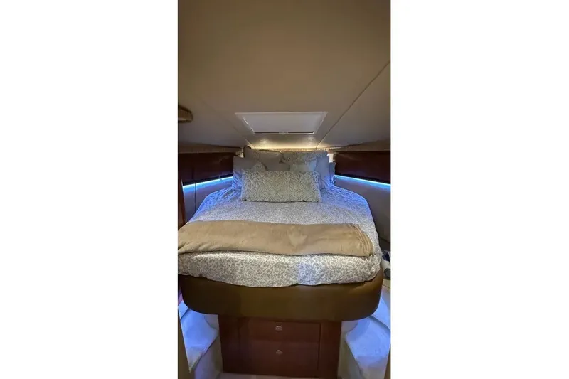 Slide: The Image of Luxurious cabin interior of 2006 Sea Ray 44 Sundancer yacht with cozy bedding. - 26