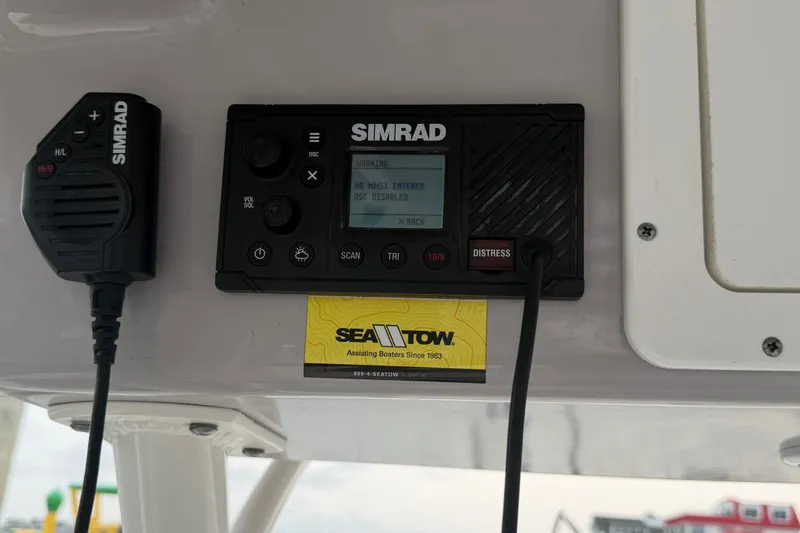 Slide: The Image of Simrad marine radio and microphone on Seaborn SX 239, 2021 model, with Sea Tow card. - 15