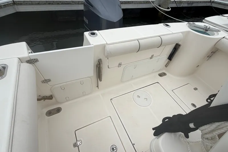 Slide: The Image of Seaborn SX 239 boat interior, 2021 model, featuring storage compartments and seating area. - 17