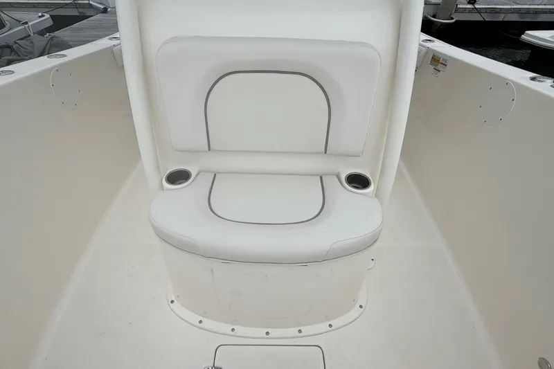 Slide: The Image of White seating area on a 2021 Seaborn SX 239 boat with cup holders. - 18