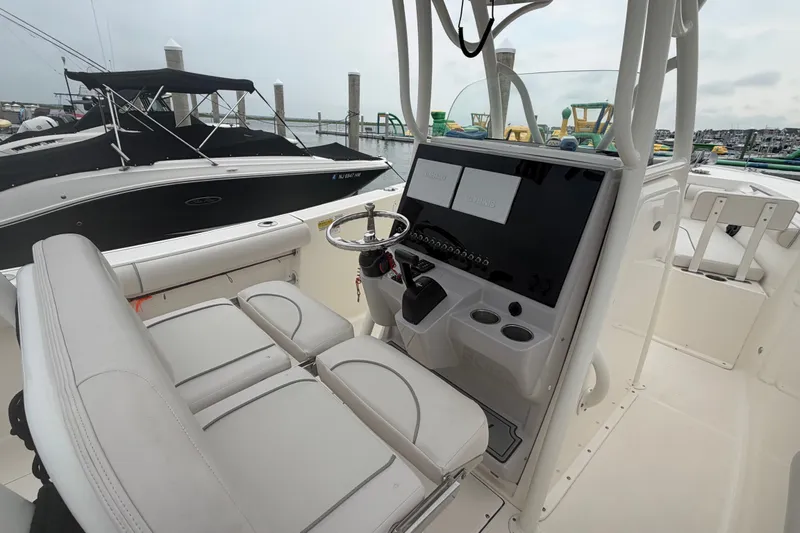 Slide: The Image of Interior view of a 2021 Seaborn SX 239 boat with modern helm and seating. - 23