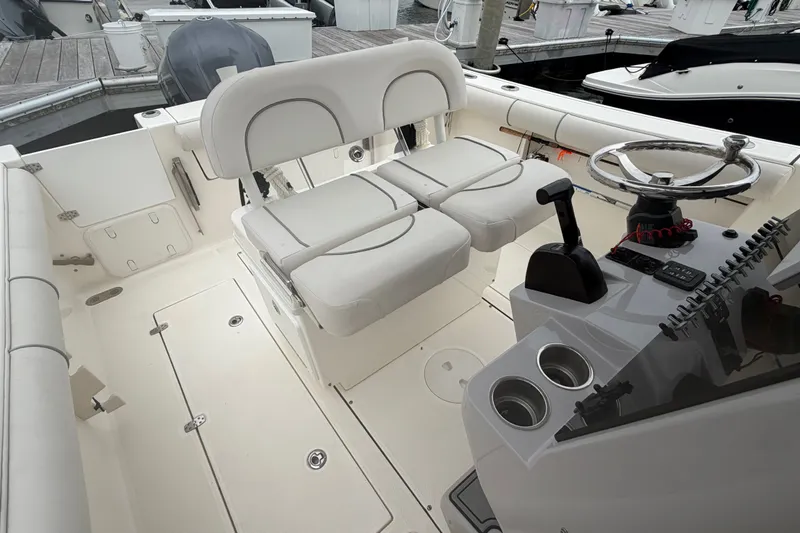 Slide: The Image of Interior of a 2021 Seaborn SX 239 boat with dual seating and steering console. - 24