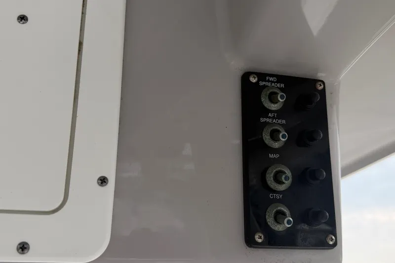 Slide: The Image of Control panel on a 2021 Seaborn SX 239 boat with labeled switches. - 14