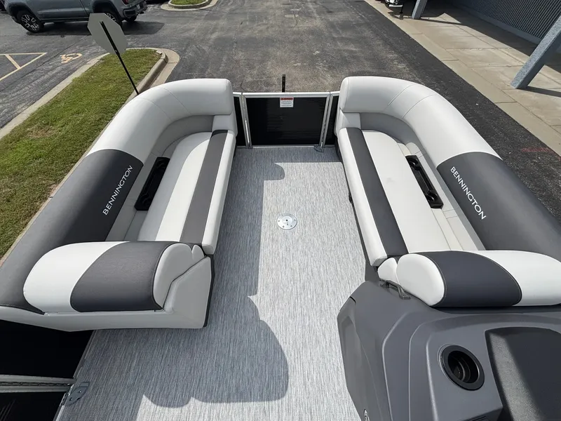 Slide: The Image of The image shows the interior of a 2027 Bennington 22 S1SR SPS with gray and white seating. - 16