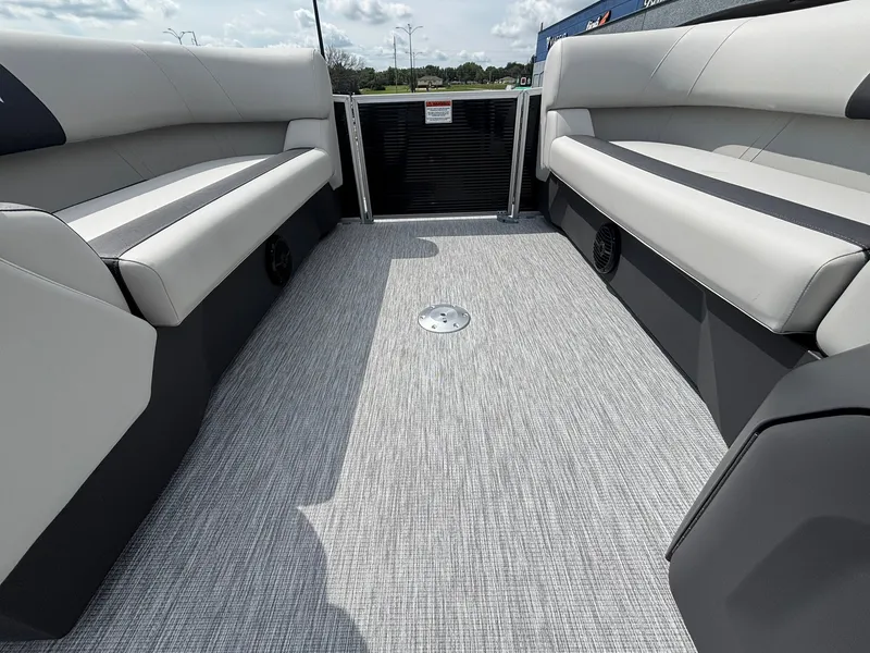 Slide: The Image of The image shows the interior of a 2027 Bennington 22 S1SR SPS with gray upholstered seating. - 17