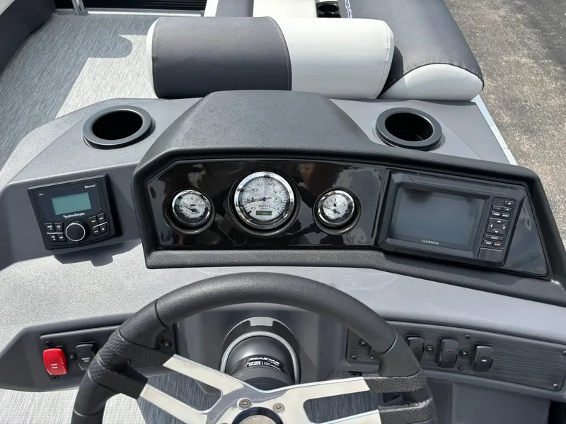 Slide: The Image of The image shows the dashboard of a Bennington 22 S1SR SPS boat with instruments and controls. - 21