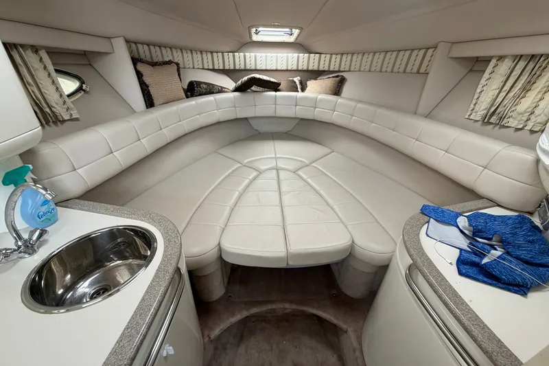 Slide: The Image of Interior of a 2002 Formula 27 Performance Cruiser with white leather seating and compact sink. - 15