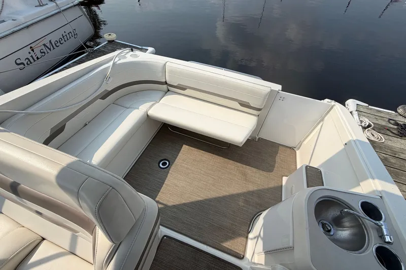 Slide: The Image of The image shows the cockpit of a 2002 Formula 27 Performance Cruiser with white upholstery and a small table. - 9