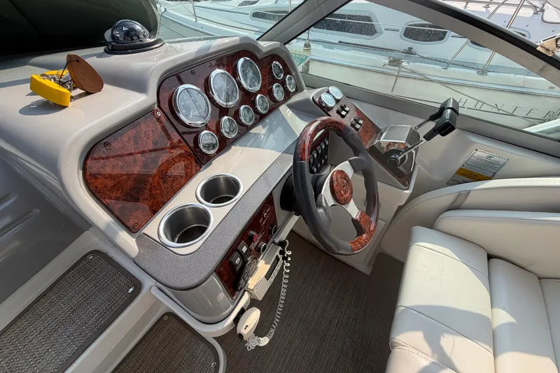 Slide: The Image of Cockpit of 2002 Formula 27 Performance Cruiser with wood accents and modern controls. - 14