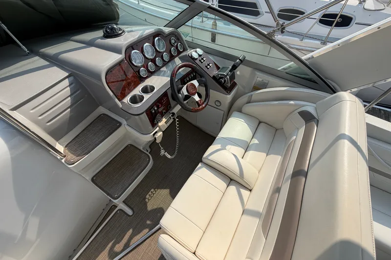 Slide: The Image of 2002 Formula 27 Performance Cruiser cockpit with leather seating and modern dashboard controls. - 10