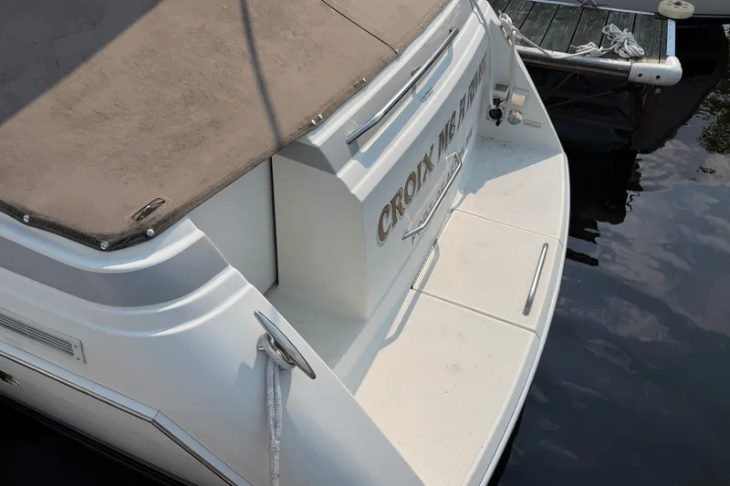 Slide: The Image of 2002 Formula 27 Performance Cruiser docked, rear view with name visible. - 5