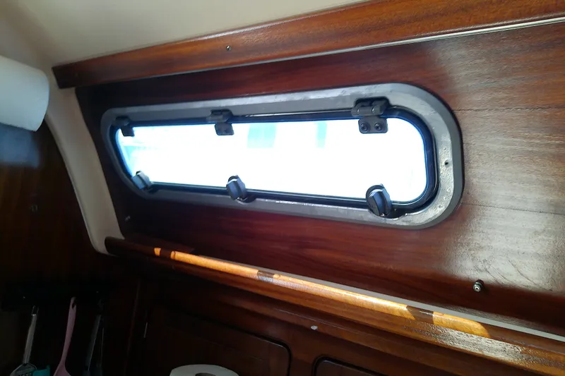 Slide: The Image of Interior view of Bavaria Cruiser 37 yacht window, showcasing wooden paneling, 2001 model. - 48