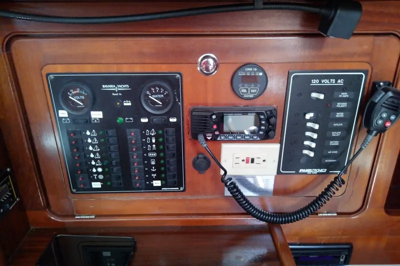 Slide: The Image of Control panel of a 2001 Bavaria Cruiser 37 yacht with gauges and switches. - 30