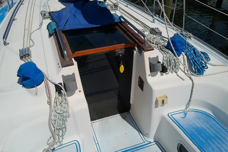 Slide: The Image of 2001 Bavaria Cruiser 37 sailboat cockpit with ropes and hatch entrance. - 11