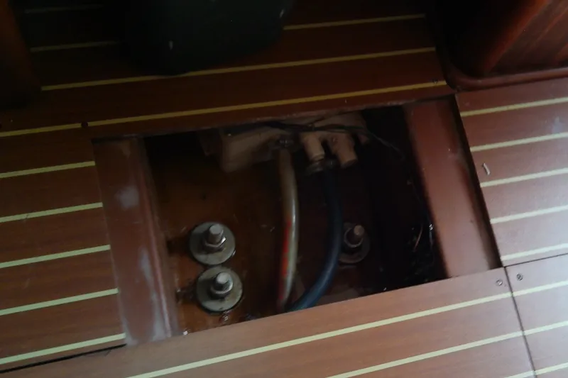 Slide: The Image of Open floor panel on 2001 Bavaria Cruiser 37 yacht, revealing interior components. - 51