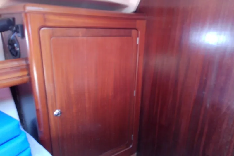Slide: The Image of Wooden cabinet interior of 2001 Bavaria Cruiser 37 yacht. - 44