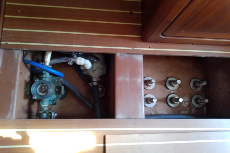 Slide: The Image of Interior view of Bavaria Cruiser 37 (2001) showing plumbing and mechanical components. - 50