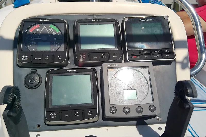 Slide: The Image of Control panel of a 2001 Bavaria Cruiser 37 sailboat with Raymarine instruments. - 13