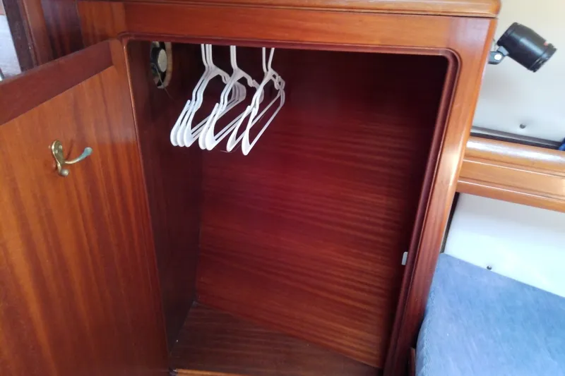 Slide: The Image of Wooden closet with hangers inside Bavaria Cruiser 37 yacht, 2001 model. - 41