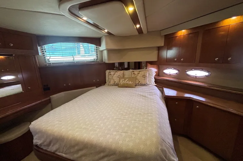 Slide: The Image of Luxurious bedroom interior of 2004 Cruisers Yachts 455 Express Motoryacht with elegant wood finish. - 38