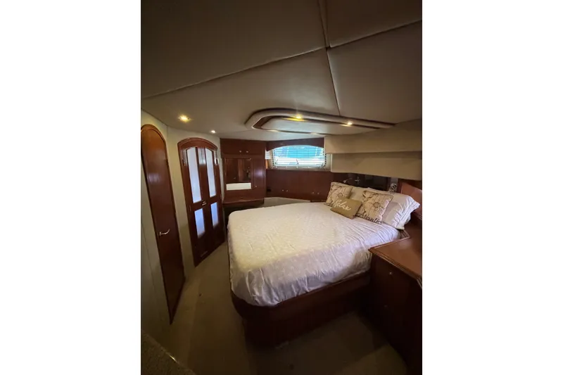 Slide: The Image of Luxurious bedroom interior of 2004 Cruisers Yachts 455 Express Motoryacht with elegant wood finishes. - 40