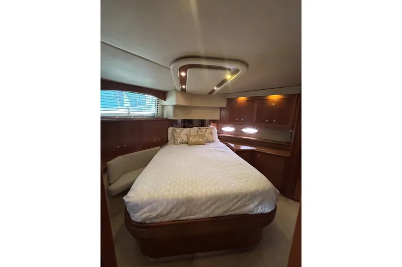 Slide: The Image of Luxurious bedroom interior of 2004 Cruisers Yachts 455 Express Motoryacht with elegant wood finishes. - 39