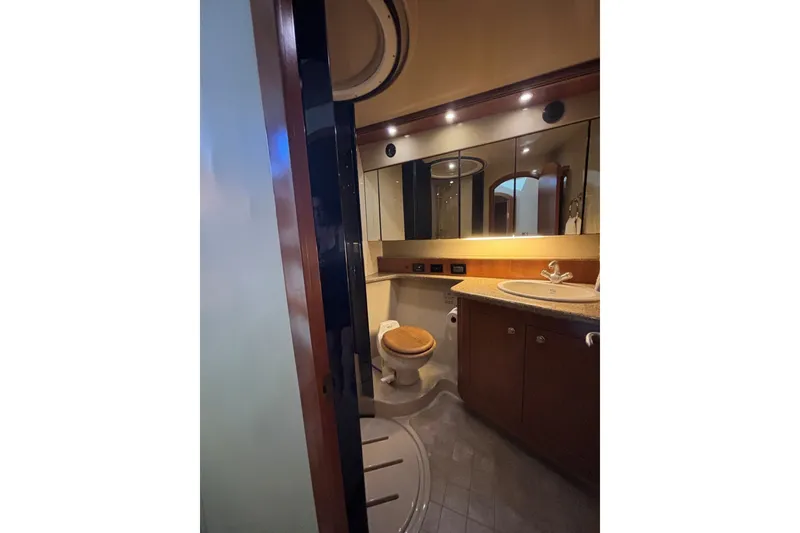 Slide: The Image of Luxurious bathroom in 2004 Cruisers Yachts 455 Express Motoryacht with elegant fixtures. - 36