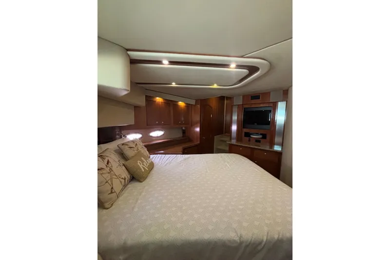Slide: The Image of Luxurious bedroom interior of 2004 Cruisers Yachts 455 Express Motoryacht with elegant wood finishes. - 41